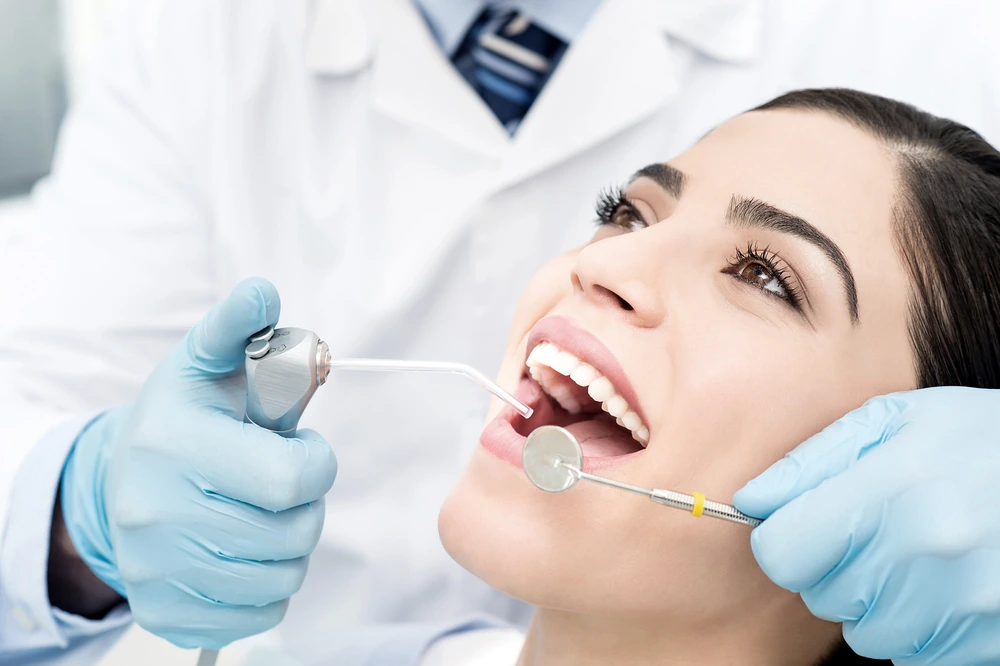 Professional preventive dental examination and cleaning procedure